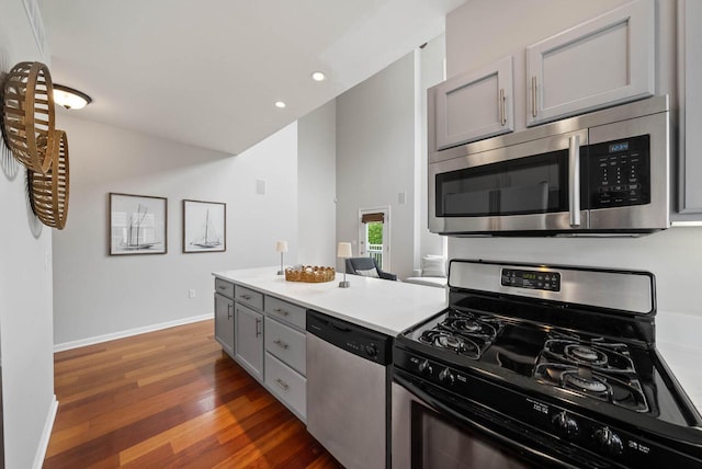 485 Mill St, Fontana, WI 53125 - kitchen with appliances with stainless steel finishes, gray cabinetry, wood finished floors, recessed lighting, and baseboards