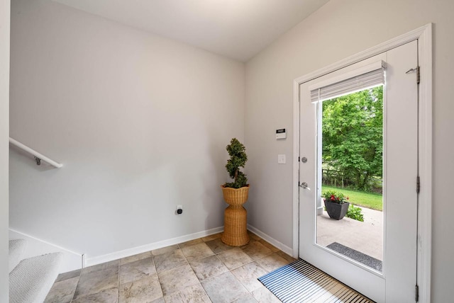 485 Mill St, Fontana, WI 53125 - doorway featuring baseboards, stairway, and light stone finish flooring