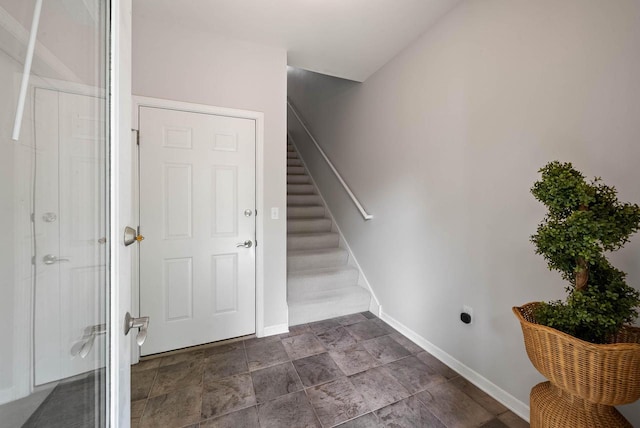 485 Mill St, Fontana, WI 53125 - stairs with baseboards and stone finish flooring