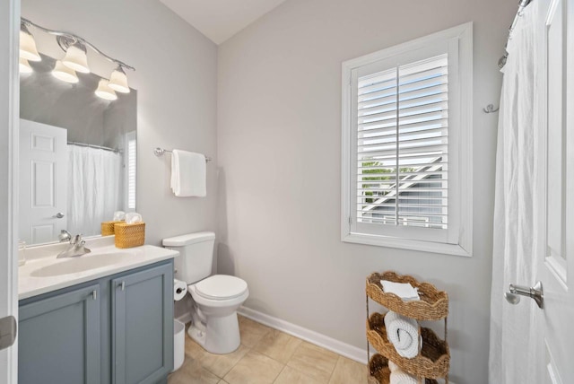 485 Mill St, Fontana, WI 53125 - full bathroom with vanity, toilet, baseboards, and tile patterned flooring