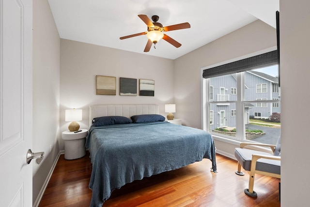 485 Mill St, Fontana, WI 53125 - bedroom featuring wood finished floors, baseboards, and ceiling fan