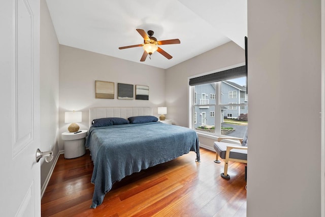 485 Mill St, Fontana, WI 53125 - bedroom featuring wood finished floors, baseboards, and a ceiling fan