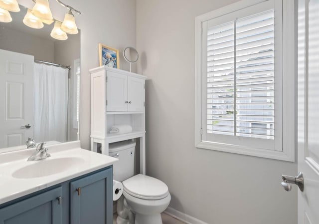 485 Mill St, Fontana, WI 53125 - full bathroom with vanity, toilet, a shower with shower curtain, and baseboards