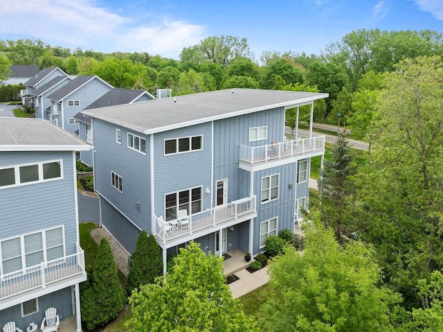 485 Mill St, Fontana, WI 53125 - rear view of house with a balcony and board and batten siding
