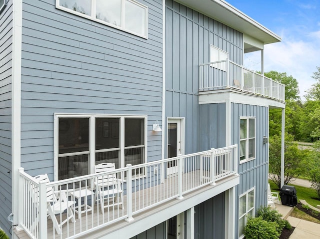 485 Mill St, Fontana, WI 53125 - view of side of home with a balcony and board and batten siding