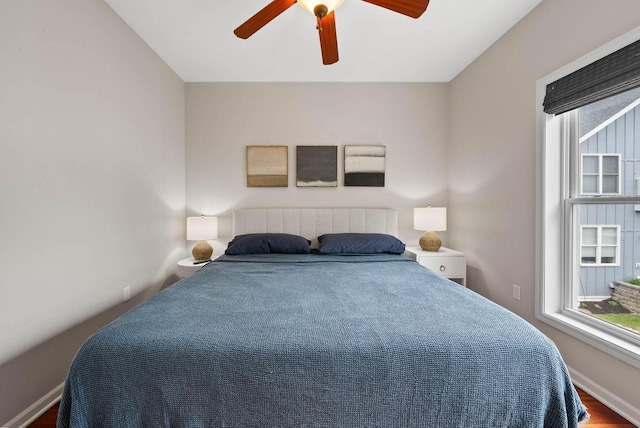 485 Mill St, Fontana, WI 53125 - bedroom featuring ceiling fan, wood finished floors, and baseboards