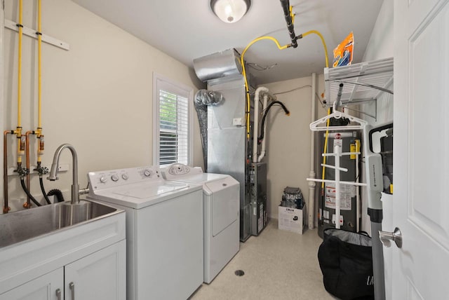 485 Mill St, Fontana, WI 53125 - laundry room featuring washing machine and dryer, water heater, and cabinet space