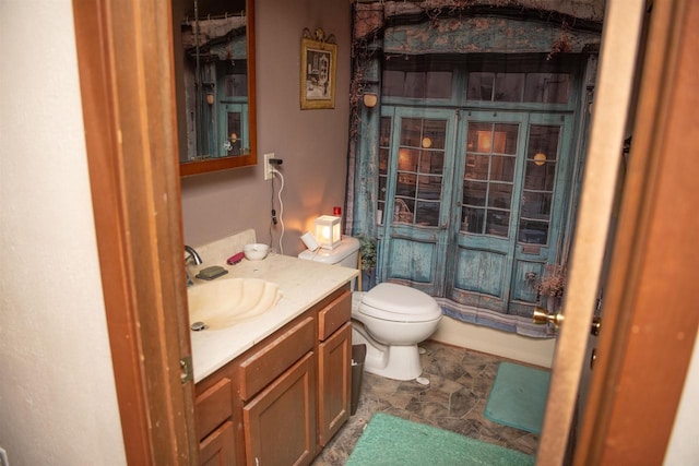 207 S Beach St, Plainfield, WI 54966 - bathroom with toilet, vanity, and stone finish floors
