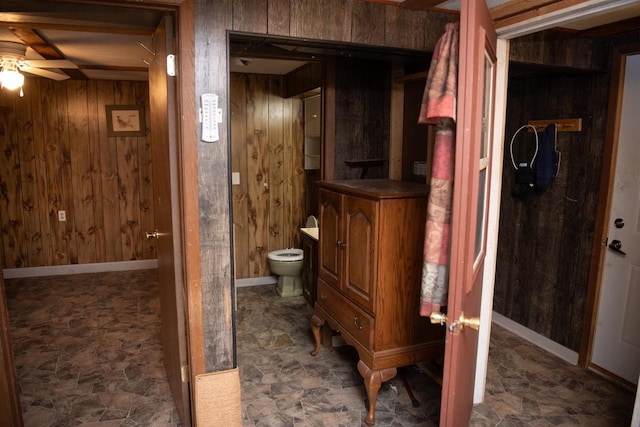 207 S Beach St, Plainfield, WI 54966 - bathroom with wood walls, a ceiling fan, vanity, and toilet