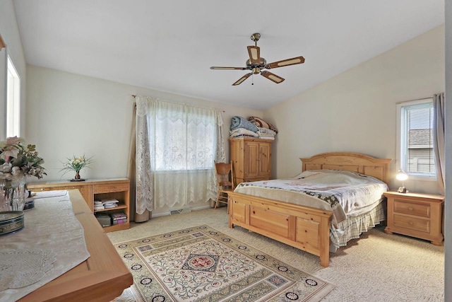 8124 W Imperial Dr, Franklin, WI 53132 - bedroom featuring multiple windows, vaulted ceiling, light colored carpet, and a ceiling fan