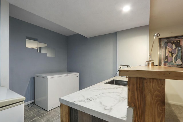 8124 W Imperial Dr, Franklin, WI 53132 - washroom featuring a sink and baseboards