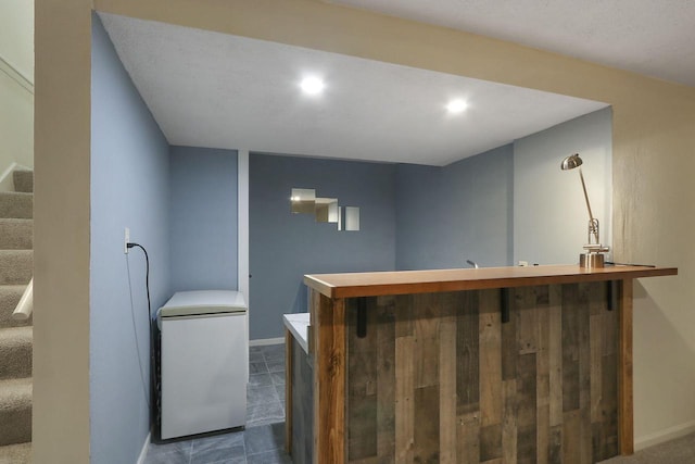 8124 W Imperial Dr, Franklin, WI 53132 - indoor wet bar featuring refrigerator, stairway, baseboards, and recessed lighting