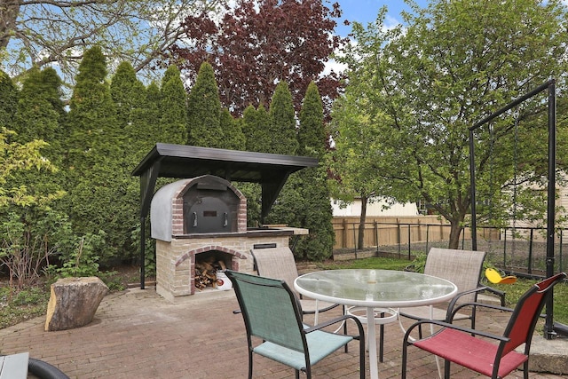 8124 W Imperial Dr, Franklin, WI 53132 - view of patio with an outdoor fireplace and outdoor dining area