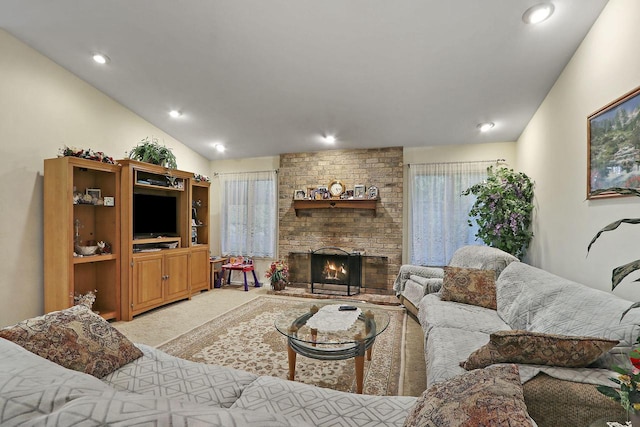 8124 W Imperial Dr, Franklin, WI 53132 - living room with light carpet, a brick fireplace, vaulted ceiling, and recessed lighting