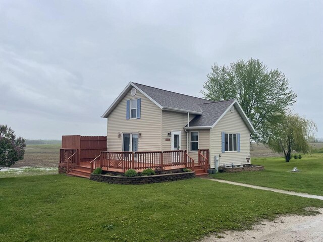 6831 Marken Rd, Valders, WI 54245 - view of front of property with a wooden deck, roof with shingles, and a front yard