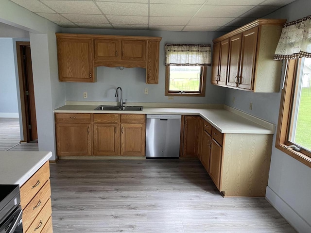 6831 Marken Rd, Valders, WI 54245 - kitchen with dishwasher, a sink, light countertops, brown cabinetry, and a drop ceiling