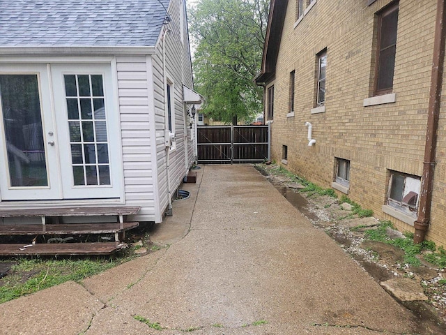 4227 W Concordia Ave, Milwaukee, WI 53216 - view of side of property with roof with shingles and french doors