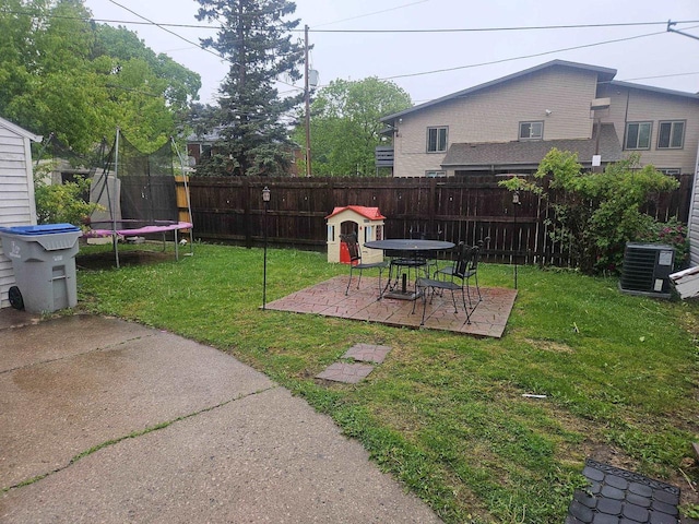 4227 W Concordia Ave, Milwaukee, WI 53216 - view of yard with central AC, a patio, and a trampoline