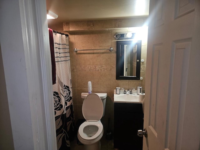 4227 W Concordia Ave, Milwaukee, WI 53216 - full bathroom with toilet, vanity, and tile walls
