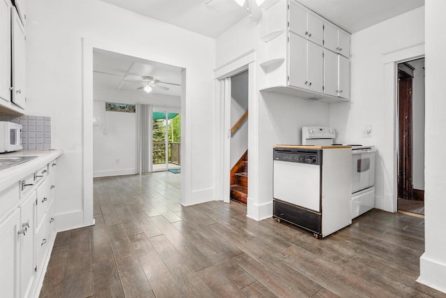 25 E 1st St, Clintonville, WI 54929 - kitchen with ceiling fan, white appliances, dark wood finished floors, baseboards, and light countertops