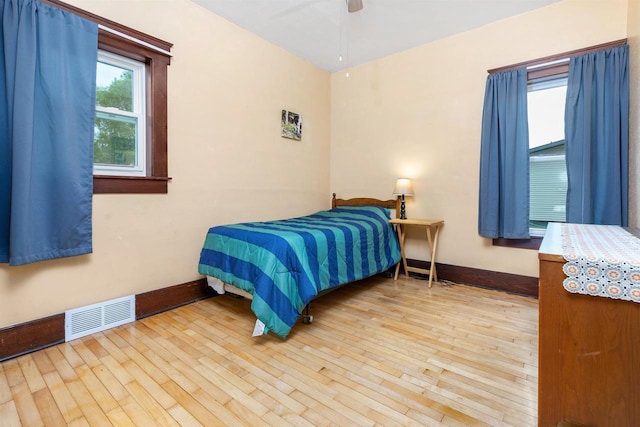 25 E 1st St, Clintonville, WI 54929 - bedroom with baseboards, wood-type flooring, and ceiling fan