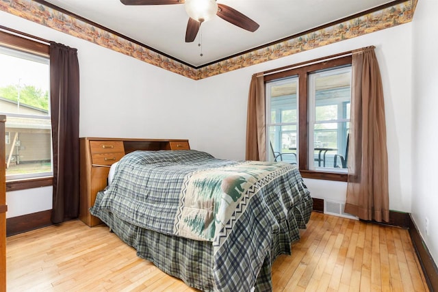 25 E 1st St, Clintonville, WI 54929 - bedroom featuring light wood-style floors, baseboards, and ceiling fan