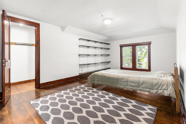 25 E 1st St, Clintonville, WI 54929 - bedroom with wood-type flooring and baseboards
