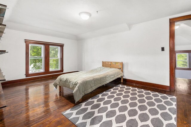 25 E 1st St, Clintonville, WI 54929 - bedroom featuring hardwood / wood-style flooring, baseboards, and multiple windows
