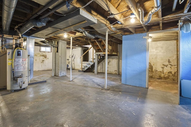 25 E 1st St, Clintonville, WI 54929 - below grade area featuring gas water heater and stairway