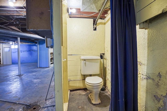 25 E 1st St, Clintonville, WI 54929 - bathroom featuring concrete flooring and toilet