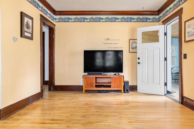 25 E 1st St, Clintonville, WI 54929 - living room with ornamental molding, light wood-type flooring, and baseboards