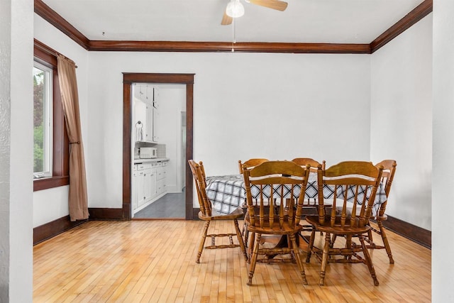 25 E 1st St, Clintonville, WI 54929 - dining room featuring ornamental molding, wood-type flooring, baseboards, and a ceiling fan