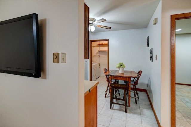 887 Kottke Dr Unit 887, Madison, WI 53719 - dining room with a ceiling fan, light tile patterned floors, and baseboards