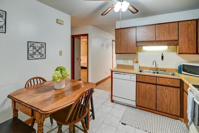 887 Kottke Dr Unit 887, Madison, WI 53719 - kitchen featuring white appliances, a sink, a ceiling fan, and brown cabinetry