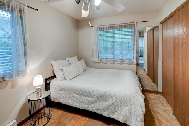 887 Kottke Dr Unit 887, Madison, WI 53719 - bedroom featuring baseboard heating, a ceiling fan, and baseboards