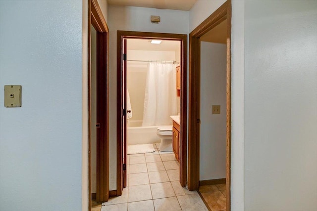 887 Kottke Dr Unit 887, Madison, WI 53719 - hallway featuring light tile patterned flooring and baseboards