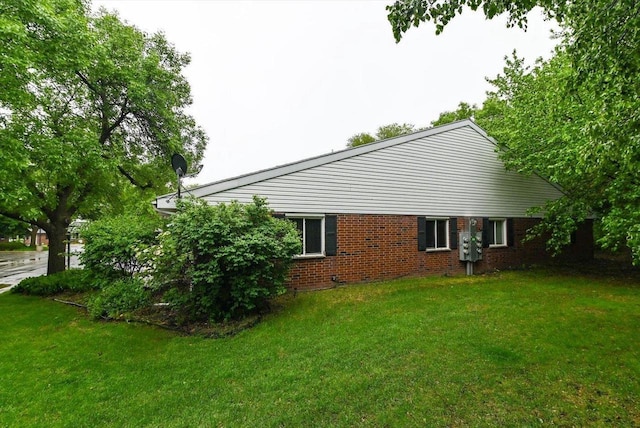 887 Kottke Dr Unit 887, Madison, WI 53719 - view of side of home with a lawn and brick siding