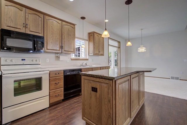 3205 N Mistwood Ln, Appleton, WI 54914 - kitchen with black appliances, a sink, a kitchen island, dark wood-style floors, and hanging light fixtures