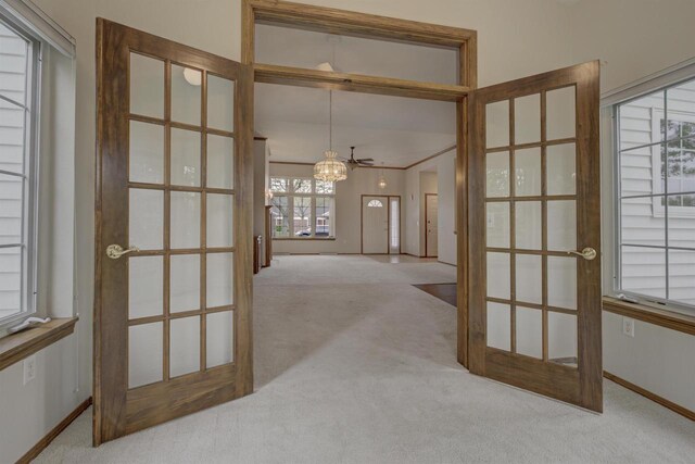 3205 N Mistwood Ln, Appleton, WI 54914 - hall featuring french doors, carpet flooring, a chandelier, and baseboards