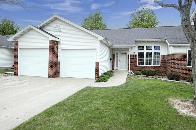 3205 N Mistwood Ln, Appleton, WI 54914 - ranch-style home with a garage, brick siding, driveway, roof with shingles, and a front yard