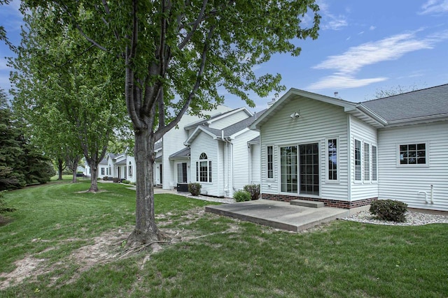 3205 N Mistwood Ln, Appleton, WI 54914 - rear view of property featuring a patio and a lawn