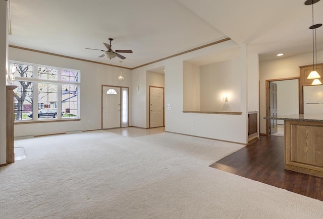 3205 N Mistwood Ln, Appleton, WI 54914 - unfurnished living room with carpet floors, ceiling fan, baseboards, recessed lighting, and ornamental molding