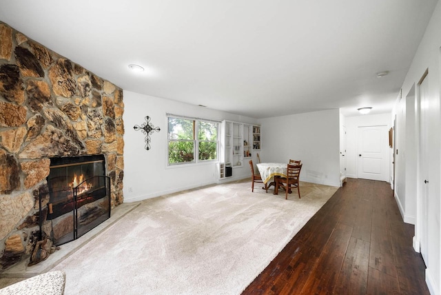 483 W S St Unit A, Lake Geneva, WI 53147 - dining space with hardwood / wood-style floors, a fireplace, and baseboards