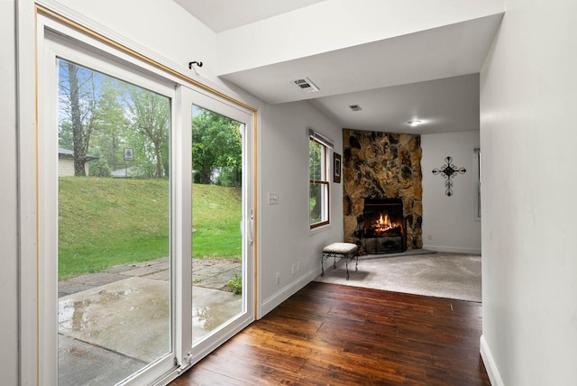 483 W S St Unit A, Lake Geneva, WI 53147 - entryway featuring baseboards, dark wood-style floors, and a fireplace