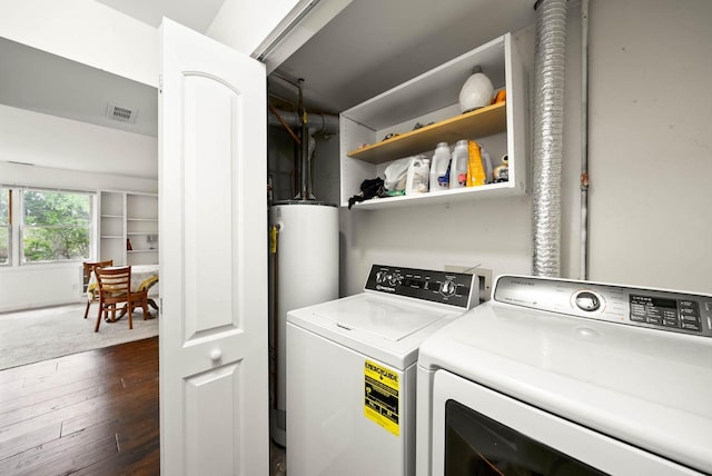 483 W S St Unit A, Lake Geneva, WI 53147 - washroom featuring washing machine and clothes dryer, water heater, and dark wood-style flooring
