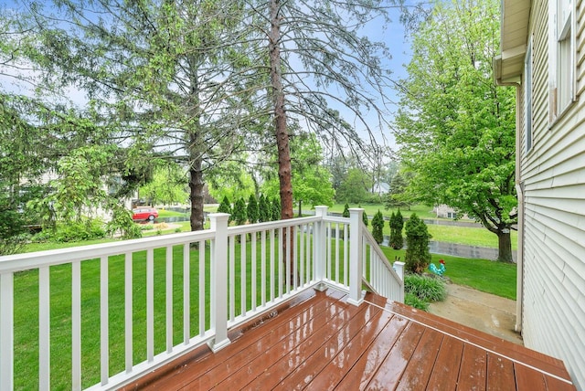 483 W S St Unit A, Lake Geneva, WI 53147 - wooden terrace featuring a lawn