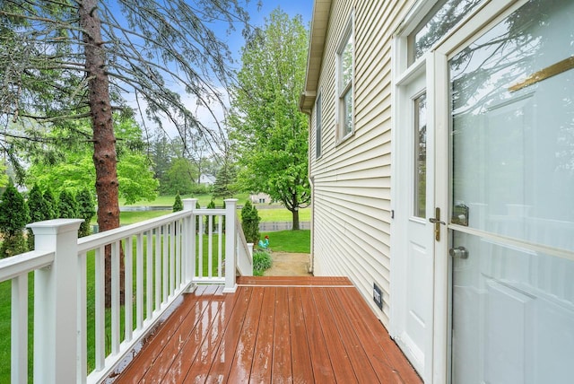 483 W S St Unit A, Lake Geneva, WI 53147 - wooden terrace featuring a lawn