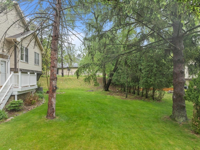 483 W S St Unit A, Lake Geneva, WI 53147 - view of green lawn featuring a deck