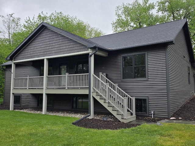 9435 402nd Ave, Genoa City, WI 53128 - rear view of property featuring a lawn, stairs, a shingled roof, and a deck