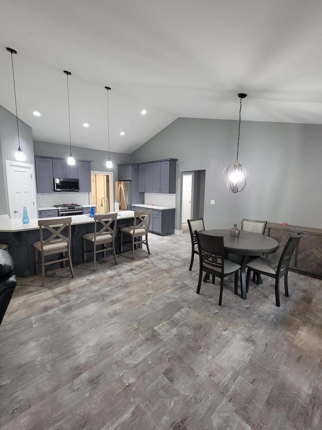 9435 402nd Ave, Genoa City, WI 53128 - dining area with lofted ceiling, wood finished floors, and recessed lighting